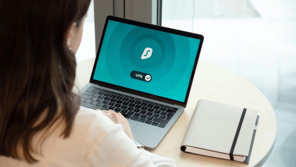 Woman at computer with VPN - More Emerging Cybersecurity Risks for Small Businesses